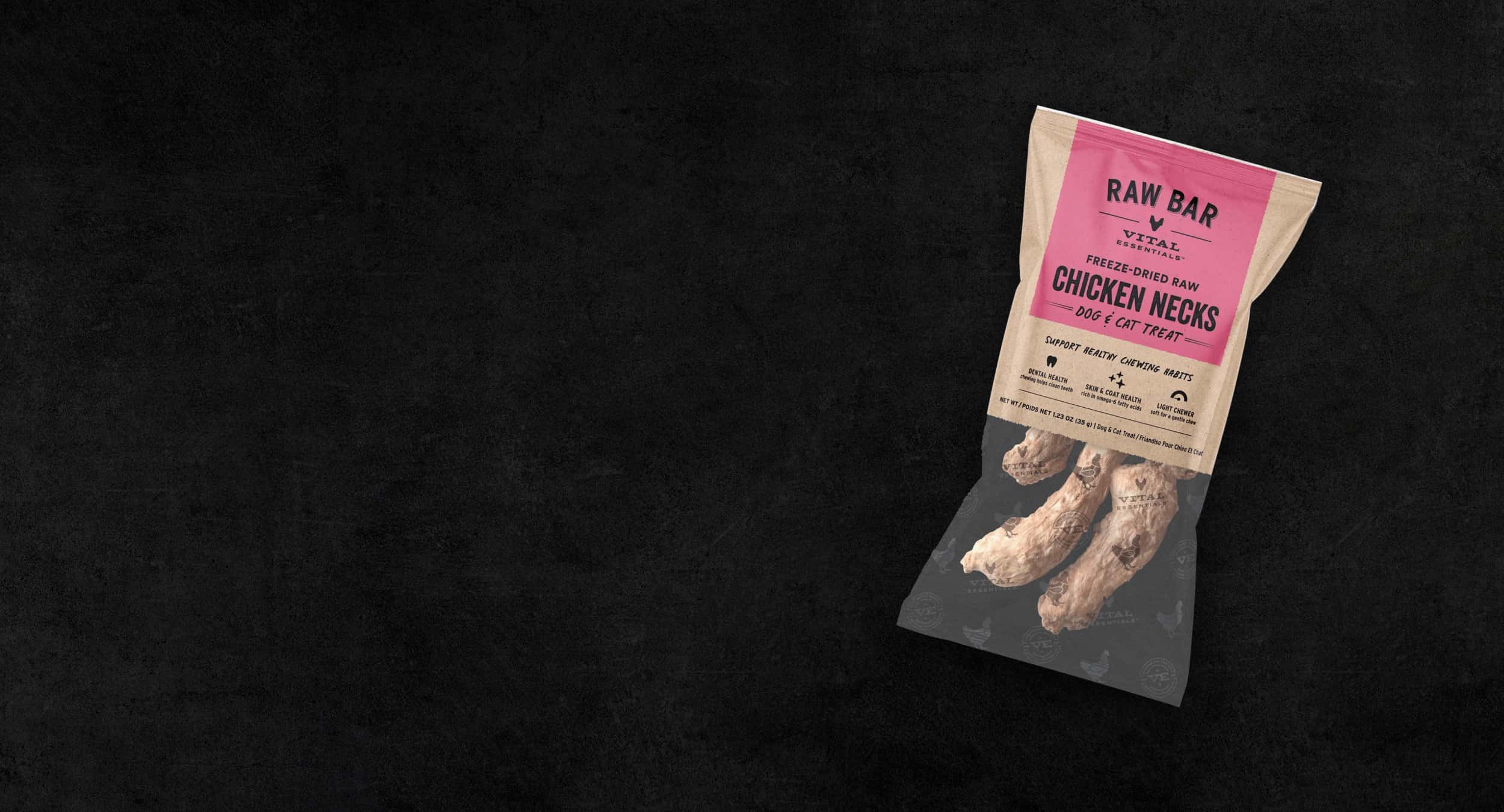 Package of Raw Bar freeze-dried chicken necks against a dark textured background, featuring detailed product information.